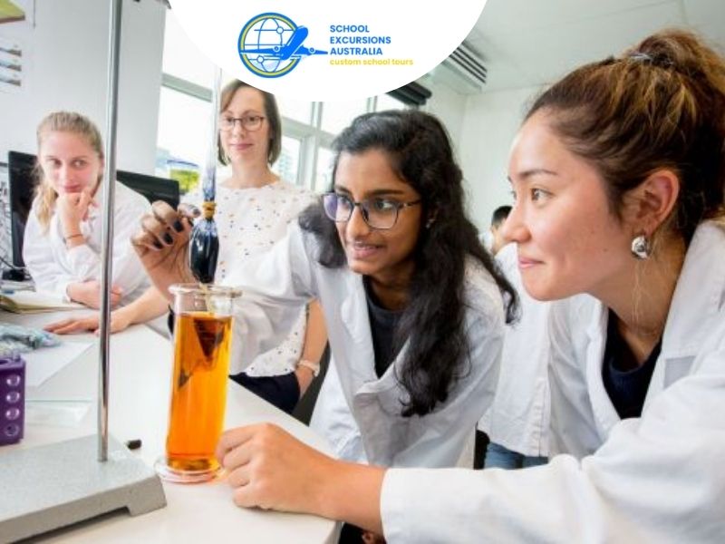 Students observing a science experiment in a laboratory during an educational STEM excursion in Melbourne