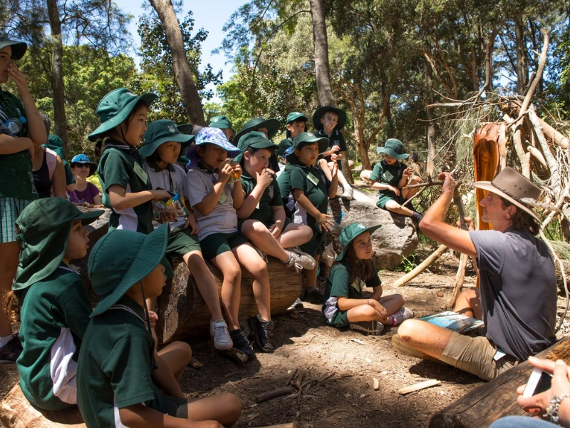School group visiting Alice Springs Desert Park as part of an interactive Alice Springs school trip program