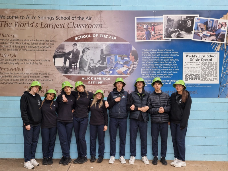 Students exploring desert ecosystems during an Alice Springs school trip with hands-on environmental learning